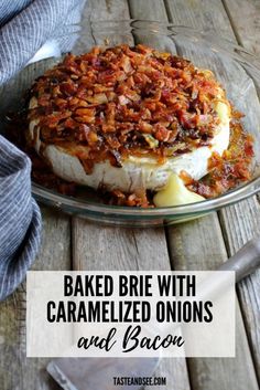 baked brie with caramelized onions and bacon in a glass dish on a wooden table