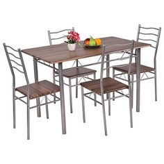 a dining table with four chairs and fruit on the top, in front of a white background