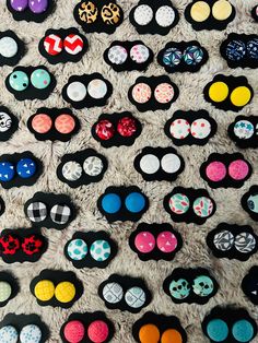 several pairs of mickey ears are displayed on a carpet