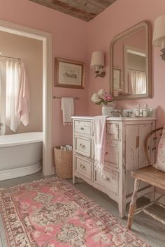 a bathroom with pink walls and white furniture