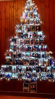 a christmas tree made out of photos and lights