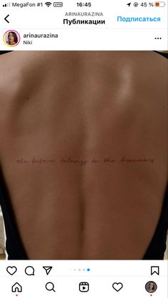 the back of a woman's body with an inscription on it that reads, i am