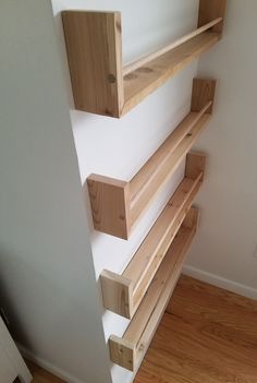 the shelves are made out of wood and have no brackets on them or they're attached to the wall