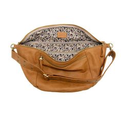 Perfect for those days when you need to carry more but you still want to go hands free! This super slouchy, oversized Crossbody from Joy Susan will give your look a boho vibe with a riveted strap and gleaming zippers with our signature logo zipper pulls. Wear it as a Crossbody or a Sling, it looks great either way! 0” high, 18” wide, 4” deep Removable and adjustable strap accented with eyelet rivets, length: 24-41” Top zip closure Front and back zipper pockets One interior zip closure pocket Bra Sling Crossbody Bag, Copper Pearl, Those Days, Zipper Pulls, Boho Vibe, Religious Gifts, Winter Accessories, Signature Logo, Scarf Styles