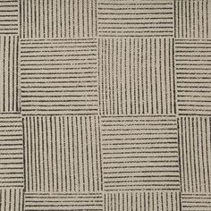 a black and white rug that has squares on it, with stripes in the middle