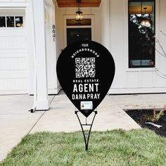 a sign in front of a house that says agent danapay on it's side