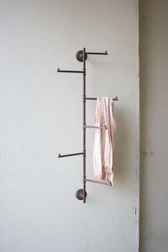 a towel rack is hanging on the wall