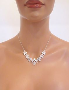 "Unique and radiant, this silver plated necklace and earring set features a lovely arrangement of cubic zirconias in various shapes and sizes. A versatile and beautiful addition to your classic, modern, or vintage-inspired wedding. This necklace measures 16 inches and extends to 18 inches. Matching earrings measure 3/4\" long. You can choose a backdrop for this piece as well, please choose from the drop down menu. Matching bracelet: https://www.etsy.com/listing/241089352/crystal-bridal-bracelet- Anniversary Jewelry Set With Cubic Zirconia Pendant, Anniversary Cubic Zirconia Jewelry Sets With Pendant, Anniversary Cubic Zirconia Pendant Jewelry Set, Elegant Rose Gold Crystal Bridal Necklace, Elegant Pendant Jewelry With Cubic Zirconia, Rose Gold Cubic Zirconia Bridal Necklace For Anniversary, Rose Gold Cubic Zirconia Diamond Necklace For Wedding, Cubic Zirconia Pendant Jewelry Sets For Wedding, Delicate Rose Gold Cubic Zirconia Bridal Necklace