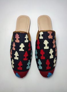 Welcome to AliDesignStore This Kilim Mules one -of-A-kind! Upper Made of a Hand-Selected Vintage Turkish Kilim Rug . Kilims Rugs Are Hand Crafted From Vegetable Yarn. Have Stronger weave. - Handcrafted - Materials : Handwoven Kilim Rug Leather Sole Leather Trimmed Leather Lining Stacked Leather Sole Rubber Under The Stacked Heel Care: Soft Clothing Brush İs Recommended To Clean The Slipper. İf Something Spill on it.You Can Clean İt a Cloth With shampoo. - Ships from a small business in Turkey Casual Multicolor Mules With Rubber Sole, Designer Slip-on Mules With Closed Toe, Multicolor Flat Slip-on Shoes, Handmade Casual Mules, Casual Multicolor Closed Toe Mules, Multicolor Mules With Rubber Sole And Round Toe, Casual Handwoven Closed Toe Mules, Multicolor Closed Toe Mules With Removable Insole, Artisan Handmade Slip-on Mules