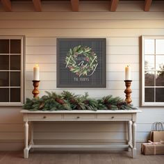 a table with two candles on it in front of a christmas wreath and holiday sign