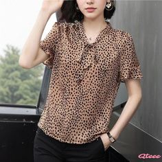 Comfortable and Cozy Short-Sleeve Blouse with Soft Silhouette Non-stretch Short Sleeve Blouse For Fall, Casual Short Sleeve Blouse For Fall, Casual Short Sleeve Fall Blouse, Casual Non-stretch Blouse For Work, Trendy Brown Short Sleeve Blouse, Brown Short Sleeve Blouse For Fall, Bow Tie Blouse, Bow Print, Half Shirts