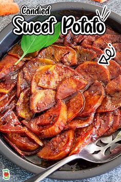 a pan filled with cooked sweet potatoes on top of a table