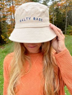 The bucket hat is here with our own salty spin. Cord fabric adds texture and easygoing style, with embroidered Salty Babe lettering to add a beachy vibe to every outfit. Aesthetic Bucket Hat, Bucket Hat Aesthetic, Baseball Hat Hairstyles, Apparel Photography, Bucket Hat Outfit, Hat Aesthetic, Swimwear Store, Lack Of Color, Shirt Design Inspiration