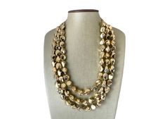 Gorgeous - perfect golden metallic statement necklace that compliments a white tee and a black dress equally! We are celebrating our favorite drinks all year long with jewelry inspired by them. These drinks have given us so many great nights, it's time we give back 😛 16 inches with a 4 inch extender chain. **All items come from a smoke and pet free home Gold-tone Beaded Party Jewelry, Party Jewelry In Gold-tone With Gold Beads, Long Beaded Necklace For Party, Costume Jewelry Style, Elegant Polished Bead Necklaces For Parties, Elegant Party Necklaces With Polished Beads, Elegant Polished Beads Necklace For Party, Party Beaded Necklaces With Polished Beads, Party Necklaces With Faceted Metal Beads, Metal Necklaces With Faceted Beads For Parties