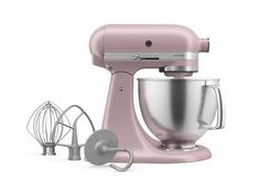 an image of a blue kitchen mixer set up on a white background with attachments