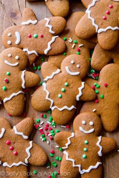 many gingerbreads with white icing and sprinkles