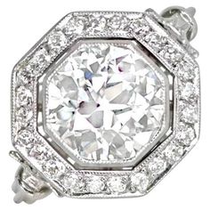 an old cut diamond ring set in 18k white gold