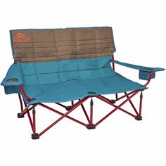 a blue and brown camping chair sitting on top of a white floor next to a red frame