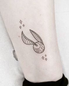 a small tattoo on the leg of a woman