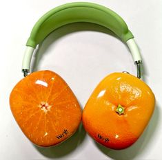 two oranges with headphones attached to them