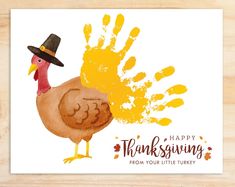 a thanksgiving card with a turkey wearing a pilgrim hat and handprints on it