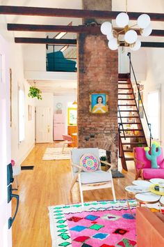 a living room filled with furniture and a fire place