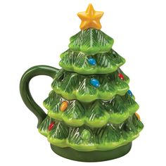 a green ceramic christmas tree mug with lights on it's sides and a star on top