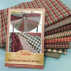 several different plaid fabrics are stacked on top of each other