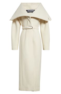 A dramatically draped neckline showcases the French label's fascination with powerful proportions in this virgin-wool twill coat boasting an ankle-skimming silhouette. Hidden-button placket Drape collar Side-seam pockets Removable belt Lined 100% virgin wool Dry clean Made in France Designer Clothing Chic Cream Wool Coat For Formal Occasions, Elegant Structured Wool Coat For Spring, Chic Wool Coat With Concealed Front Fastening, Chic Evening Wool Coat With Lapel Collar, Elegant Wool Coat With Lapel Collar For Evening, Winter Evening Outerwear With Structured Boning, Winter Evening Outerwear With Structured Shoulders, Chic Evening Outerwear With Structured Boning, Luxury Cream Outerwear For Evening