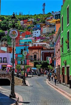 a city street filled with lots of colorful buildings