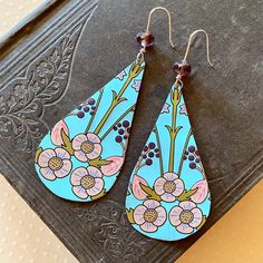 🌼 Elevate your style with artfully crafted earrings from Tin Forest! Our unique Artisan Earrings are a perfect blend of Boho Charm and eco-friendly fashion. Meticulously crafted using Upcycled and Vintage Materials, each pair has a distinct Hippy Vibe, adding a touch of free-spirited style to any ensemble. Our earrings are lightweight, easy to wear and have silicone backs to help keep them secure. Each pair of earrings is handmade from vintage and recycled tin and metal. Small scratches and imp Upcycled Tin Jewelry, Tin Jewelry, Crafted Earrings, Recycled Tin, Free Spirit Style, Artisan Earrings, Eco Friendly Fashion, Free Spirited, Anniversary Gift For Her