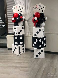 some black and white polka dot balloons are stacked on top of each other