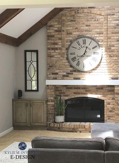 a living room filled with furniture and a large clock on the wall above a fireplace