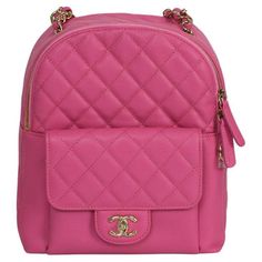 Unveil luxury with the Chanel Caviar Quilted Medium CC Day Backpack from the 2019 collection. Dressed in vibrant pink, this backpack showcases Chanel's exquisite style and quality. Crafted from iconic caviar leather, it features the classic quilted design. The structured silhouette is perfect for everyday use, enhanced by gold-tone hardware contrasting with the pink leather. The front turn-lock pocket with the Chanel CC logo provides easy access to essentials, while the top zip closure secures your belongings. Adjustable leather and chain straps ensure comfortable carrying. The spacious interior accommodates all necessities, making it ideal for the fashion-forward individual. This backpack is a statement piece, adding sophistication to any ensemble. Mochila Chanel, Vintage Chanel Bag, Chanel Suit, Day Backpacks, Chanel Brand, Trolley Bags, Chanel Caviar, Pink Backpack, Cc Logo