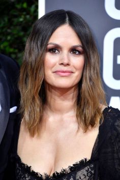 an image of a woman with shoulder length hair and black dress at the golden globe awards