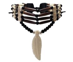 - This choker is made from authentic buffalo bone feather pendant, buffalo bone hairpipe beads, genuine leather, 6mm round metal beads, and 6mm round black synthetic beads.  - The neckline is 13.5 inches long (without the leather ties).  - The pendant is hand carved from authentic buffalo bone.  - This is a traditional 4 strand tribal bone choker.  - This jewelry is 100% handmade in the USA. We accept custom orders, just message us to discuss your ideas. Bone Choker, Avatar Dr, Peter Quill, Bone Jewelry, Jewelry Fashion Trends, Feather Pendant, Bone Beads, Fantasy Jewelry, Choker Necklaces