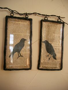 two framed pictures with black birds on them