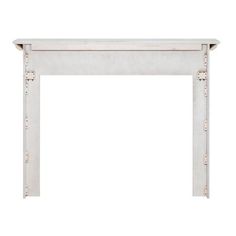 a white marble fireplace mantel with metal studs