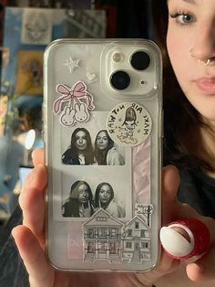 a woman holding up a cell phone case with pictures on the front and back of it