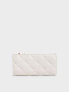 Our cream-coloured Danika long wallet deserves to be in your seasonal wardrobe. Make a strong impression with this attention-grabbing quilted wallet — no matter the occasion or location, all eyes will be on you. Equally competent in terms of functionality, the zip closure keeps your cash and cards safe when you are out and about. Try it with a pastel outfit and complete your look with a pair of Mary Jane pumps. Seasonal Wardrobe, Quilted Wallet, Pastel Outfit, Mary Jane Pumps, Charles Keith, All Eyes, Out And About, All About Eyes, Long Wallet