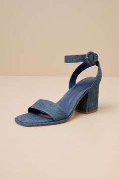 Nothing's easier than matching your favorite 'fits with the D'Amelio Footwear Imery Blue Jean Denim Ankle Strap High Heel Sandals! Woven denim fabric shapes these essential heels with a square footbed, a slender vamp strap, and a single sole silhouette. Wide straps sprout from the sides and wrap around the ankle to secure with a covered, circular buckle, all atop a chunky block heel. 3. 25" block heel. Cushioned insole. Rubber sole has nonskid markings. Man Made Materials. Imported. Lulus | Imer Square Toe Shoes, Ankle Strap High Heels, Sandal Heels, Size 11 Heels, Blue Heels, Chunky Block Heels, Ankle Wrap, Heel Sandal, Blue Jean