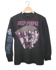 Vintage Deep Purple Perfect Stranger Tour 1985 Long Sleeve T-Shirt Size: Medium Measurements: 19.5" x 25" Material: 100% Cotton  Stitch: Single Condition: Perfect Natural fade with no stains or holes *Please note vintage sizing can be different from today's sizing, all exact measurements provided. Long Sleeve Graphic T-shirt For Concerts, Vintage Black T-shirt For Fall, Punk Band Logo Crew Neck Top, Alternative Style T-shirt For Fall Concert, 90s Style Tops For Fan Merchandise In Fall, Vintage Tops For Fall Concert, Vintage Top For Fall Concert, Band Logo Crew Neck Tops, Band Logo Crew Neck Tops For Fans