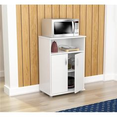 ThisMicrowaveCabinetHasAFunctionalModernDesignThatIsAnExcellentChoiceForYourHomeOrOfficeBreakRoom.ItFeatures2DoorsWhichConcealAmpleStorageSpaceAsWellAsAnOpenShelfForAdditionalAccessories.SolidCompositeWoodIsLaminatedInDoubleFacedDurable&ElegantLaricinaWhiteFinishedMelamineWhichIsStainHeatAndScratchResistant. Microwave Cabinet Free Standing, Kitchen Microwave Cabinet, Microwave Cart, Microwave Cabinet, Office Break Room, Kitchen Microwave, Microwave Stand, Utility Cabinets, Microwave In Kitchen