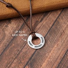 "This necklace is engraved with kid's names on one side. You can personalize the other side with any custom phrase. It is an adjustable size, which is adjustable by sliding the knots on both sides, designed for everyday wear. Available in sterling silver with 18K gold plate options, this is the perfect gift for Father's Day. P R O D U C T ∙ I N F O * Materials:  Pendant is 100% sterling silver. Cord is made from PU leather. * Word limit: up to 8 short words on the back * Finishing: Silver, yello Cheap Father's Day Silver Name Necklace, Dad Necklace, Husband Anniversary Gift, Necklace With Kids Names, Husband Anniversary, Kids Names, Personalized Gifts For Dad, Anniversary Gifts For Husband, Dad Birthday Gift