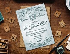 a letterpress wedding suite with scrabbles and stamps on the table next to it