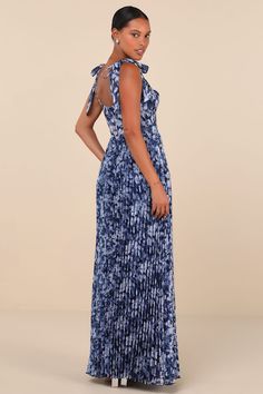 Everyone knows that you're a style icon, but the Lulus Illustrious Aura Navy Blue Floral Bustier Tie-Strap Maxi Dress will have them in awe all over again! A timeless floral print adorns lightly crinkled, airy woven fabric as it shapes a bustier-inspired bodice with a sweetheart neckline and seamed cups and detailing, supported by long straps that tie at the shoulders. The high, fitted waist top a flowy, pleated A-line skirt that falls to as sweeping maxi hem. Hidden back zipper/clasp. Fit: This Long Dresses For Women, Bridesmaid Dresses Boho, Vegas Dresses, Floral Bustier, Derby Dress, Rush Dresses, Long White Dress, Feather Dress, Puff Sleeve Dresses