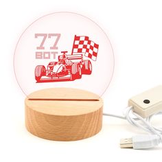 an electronic device with a red race car on the front and white background behind it