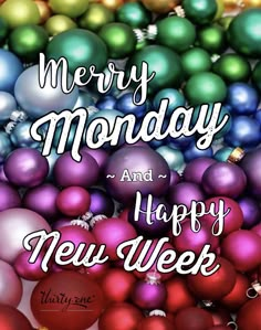 merry monday and happy new year greeting card with colorful ornaments in the background, on a white