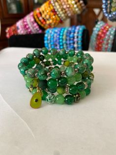 We are a small family business. Each and every single one of these bracelets have been handmade right here in our dining room with all the love and care. We have all kind of designs and colors and we can also personalize for you.  Please reach out if you want a personalize set or single bracelet. Turquoise Wrap Bracelet Gift, Turquoise Wrap Bracelet Great For Gifts, Green Wrap Bracelet With Colorful Beads, Green Bohemian Stretch Bracelet With 8mm Beads, Bohemian Green Stretch Bracelet With 8mm Beads, Green Adjustable Wrap Bracelet As Gift, Green Handmade Wrap Bracelet For Friendship, Handmade Green Wrap Bracelet For Friendship, Unique Green Bracelets With Colorful Beads