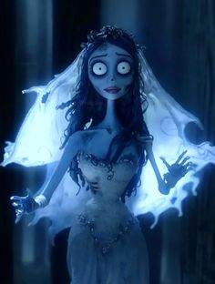 the corpse bride is dressed in white and holding her hands out to light up candles